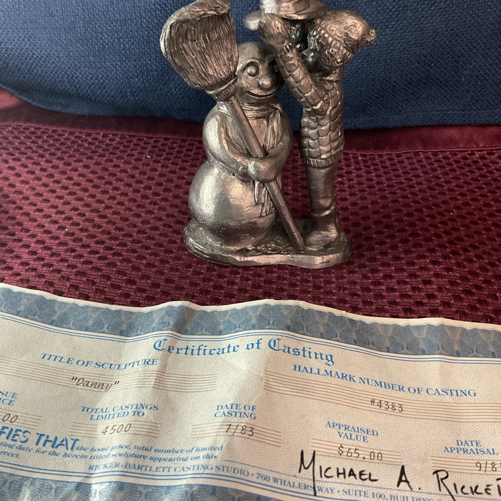 Silver Snowman and Angel Sculpture